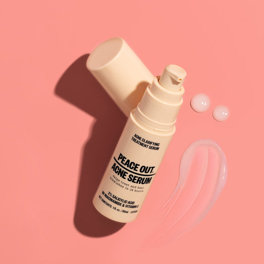 Acne Serum bottle and serum hover over a pink background