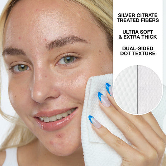 Woman cleaning her face with Peace Out's Silver Shield Face Towels, with text about silver citrate-treated fibers and dual-sided dot texture.