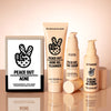 Peace Out's Acne Routine Kit's 4 essential products hover over a mirrored peach background
