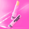 Retinol Eye Stick hovers over a pink background