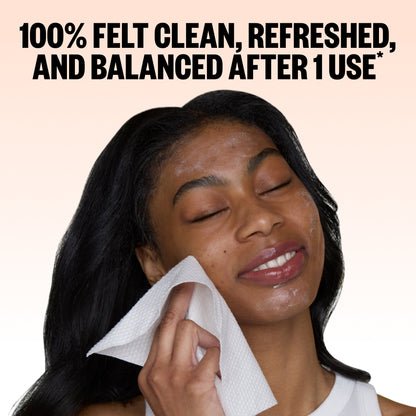 A woman with closed eyes holding a Peace Out Silver Shield Face Towel near her face, with large text at the top reading '100% FELT CLEAN, REFRESHED, AND BALANCED AFTER 1 USE'.